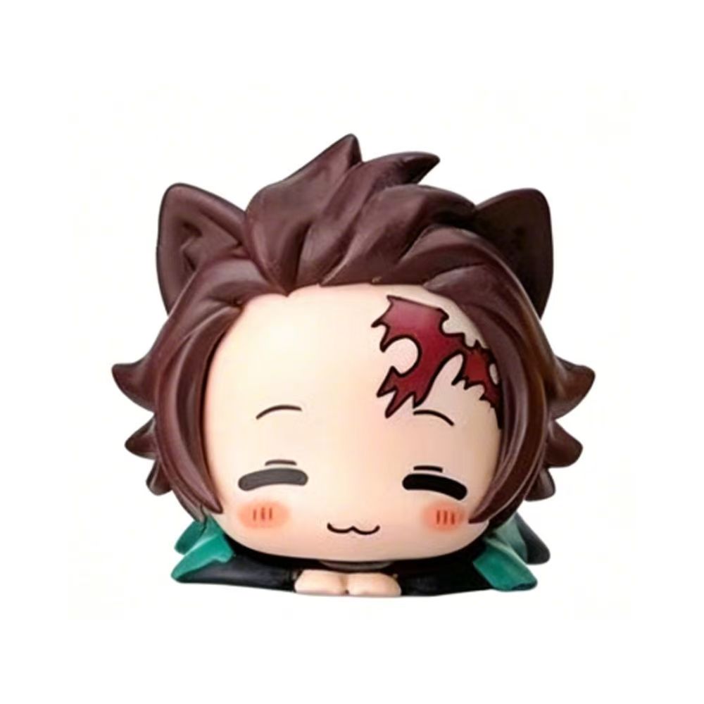 Demon Slayer-inspired cat-ear chibi mini figures arranged as desk decor