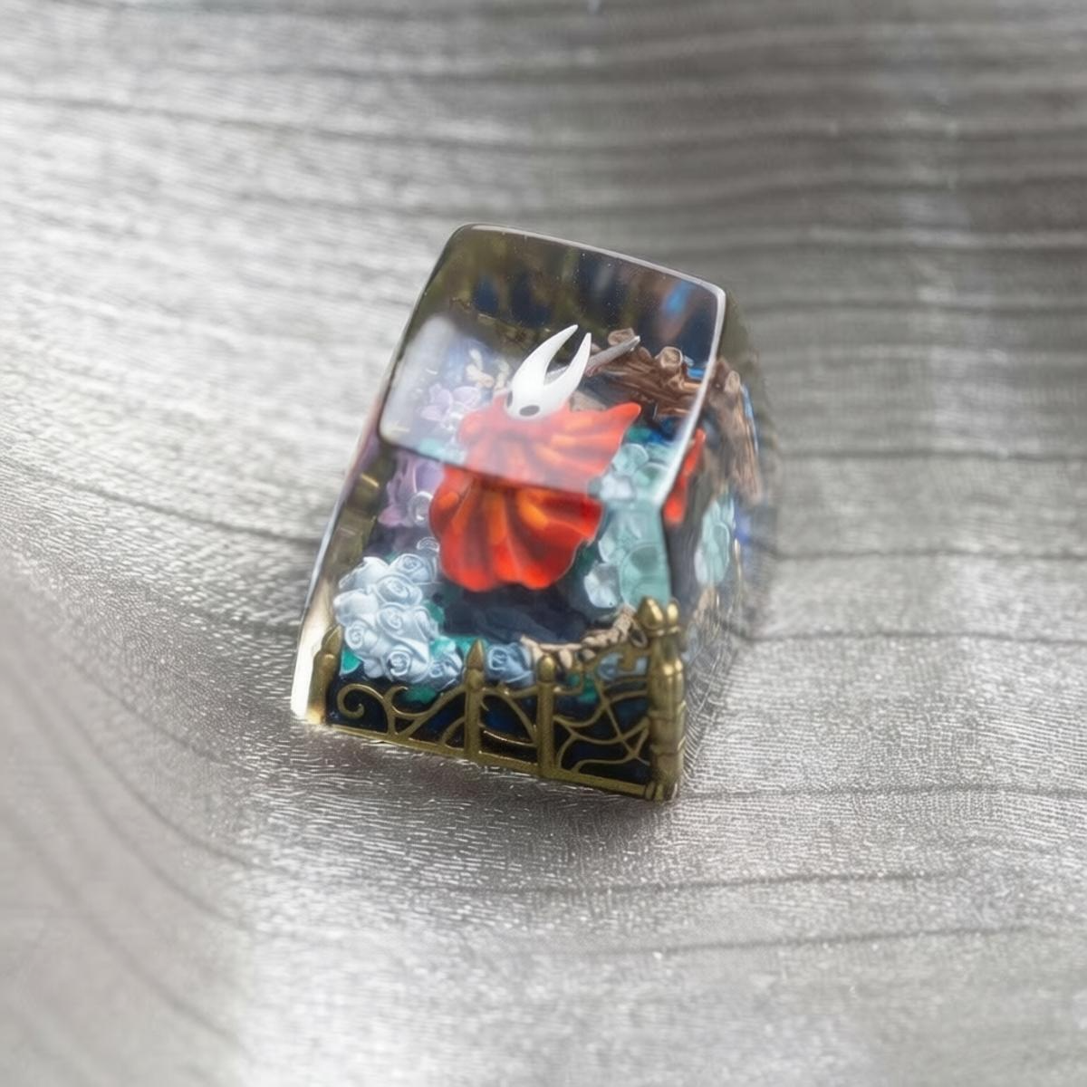 Handmade Hollow Knight resin scene keycap showing a compact artisan keycap size